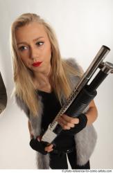 NIKOL STANDING POSE WITH SHOTGUN